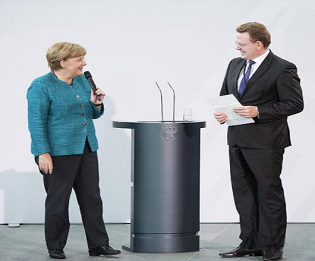 Il sindaco Andreas Hollstein con la Merkel