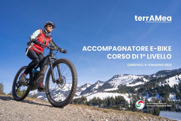 senior woman mountainbiking below the Nagelfluh mountain chain w